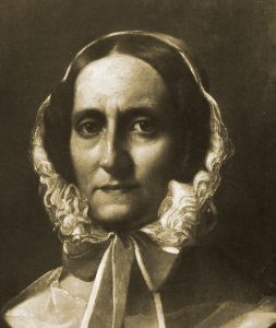 Historisches Bild einer Frau in einem Bonnet, das nostalgische Gefühle weckt.
